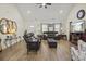 Living room with leather furniture, a fireplace with a TV mounted above, and decorative accents at 113 Edwards Ln., Longs, SC 29568