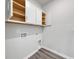 Laundry room with white cabinets, washer/dryer hookups, and wood-style flooring at 119 Arrow Wood Dr, Conway, SC 29526