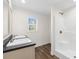 Bathroom with double vanity sinks, a shower, and wood-look flooring at 128 Forman Way, Aynor, SC 29511