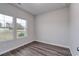 Spacious bedroom with two windows and wood-look floors at 219 Sundrop Way, Conway, SC 29526