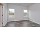 Spacious bedroom with hardwood floors and two windows at 219 Sundrop Way, Conway, SC 29526