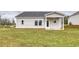Rear view of house showing patio and yard at 219 Sundrop Way, Conway, SC 29526