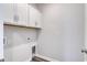 Laundry room with white cabinets and vinyl flooring at 219 Sundrop Way, Conway, SC 29526