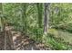 Peaceful backyard with a brick pathway alongside a tranquil waterway at 4542 Mandi Ave., Little River, SC 29566