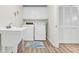 Laundry room with washer, dryer, utility sink and storage at 8500 Margate Circle # 1104, Myrtle Beach, SC 29572