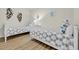 Twin bedroom with nautical-themed bedding and decor at 8500 Margate Circle # 1104, Myrtle Beach, SC 29572
