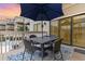 Private patio with table and chairs, perfect for outdoor dining at 9661 Shore Dr. # B30, Myrtle Beach, SC 29572