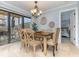 Charming dining area with a wooden table and access to the balcony at 9661 Shore Dr. # B30, Myrtle Beach, SC 29572