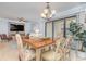 Well lit dining area with wooden table and access to balcony at 9661 Shore Dr. # B30, Myrtle Beach, SC 29572