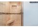 Walk-in shower with tiled walls and built-in seat at 9661 Shore Dr. # B30, Myrtle Beach, SC 29572