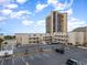 Exterior view of building, showcasing parking and nearby high-rise building at 9661 Shore Dr. # B30, Myrtle Beach, SC 29572