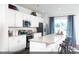 Modern kitchen with white cabinets and granite island at 204 Sundrop Way, Conway, SC 29526
