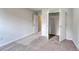 Well-lit bedroom with carpet flooring and a closet at 320 Garden Grove St, Conway, SC 29526