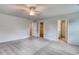 Main bedroom with carpet, ceiling fan and ensuite bathroom at 320 Garden Grove St, Conway, SC 29526