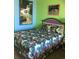 A bedroom featuring tropical-themed bedding and wall art at 6803 N Ocean Blvd. # 217, Myrtle Beach, SC 29572