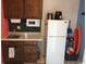 Compact kitchenette with microwave, refrigerator, and sink at 6803 N Ocean Blvd. # 217, Myrtle Beach, SC 29572