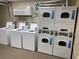 Laundry room with coin-operated washers and dryers at 6803 N Ocean Blvd. # 217, Myrtle Beach, SC 29572