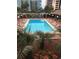 Inviting community pool surrounded by lush landscaping and lounge chairs at 6803 N Ocean Blvd. # 217, Myrtle Beach, SC 29572