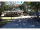 Home exterior with driveway, front porch, and basketball hoop at 1021 Myrtle Dr., Surfside Beach, SC 29575