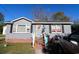 House exterior with gray siding and a wreath at 106 & 108 Jones St., Mullins, SC 29574