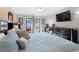King bedroom with balcony access and a large TV at 202 75Th Ave N # 5702/5703, Myrtle Beach, SC 29572