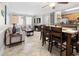 Open dining area with table and chairs, adjacent to living room at 202 75Th Ave N # 5702/5703, Myrtle Beach, SC 29572