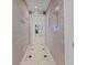 Hallway with patterned walls and tiled floor at 202 75Th Ave N # 5702/5703, Myrtle Beach, SC 29572