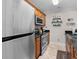Kitchen with stainless steel appliances and wood cabinets at 202 75Th Ave N # 5702/5703, Myrtle Beach, SC 29572