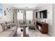 Living room with sofa, chairs, and large TV at 202 75Th Ave N # 5702/5703, Myrtle Beach, SC 29572