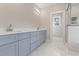 Modern bathroom featuring a double vanity, marble tile floor, and a shower at 270 Russ Rd., Loris, SC 29569