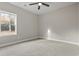 Empty bedroom with carpet flooring and a window with natural light at 270 Russ Rd., Loris, SC 29569