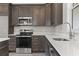 Close-up view of the kitchen showcasing the stainless steel appliances and white countertops at 270 Russ Rd., Loris, SC 29569