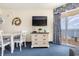 Bright dining area with ocean view and white table and chairs at 2801 S Ocean Blvd. # 1733, North Myrtle Beach, SC 29582