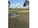 Serene backyard with a decorative bench and open space at 3723 Choppee Rd., Georgetown, SC 29440