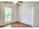 Cozy bedroom featuring hardwood floors and a window with garden view at 3723 Choppee Rd., Georgetown, SC 29440