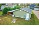 Detached green garage with covered carport and AC unit at 3723 Choppee Rd., Georgetown, SC 29440