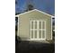 Detached storage building with white and green painted doors at 3723 Choppee Rd., Georgetown, SC 29440