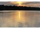Stunning sunset over calm water, creating a picturesque scene at 3723 Choppee Rd., Georgetown, SC 29440