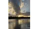 Scenic sunset view over tranquil waters with dramatic clouds at 3723 Choppee Rd., Georgetown, SC 29440