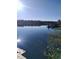 Tranquil waterfront scene with boat and lush vegetation at 3723 Choppee Rd., Georgetown, SC 29440