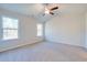 Spacious bedroom with carpeted floor, ceiling fan and large windows at 889 Busy Corner Rd., Conway, SC 29527