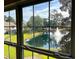 Window view of a pond with fountain and lush landscaping at 107 Pawleys Place Dr. # 107, Litchfield, SC 29585