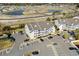 Aerial view showcasing condo building and ample parking at 1100 Possum Trot Rd. # F-213, North Myrtle Beach, SC 29582