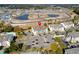 Aerial view of condo building, parking lot, and surrounding neighborhood at 1100 Possum Trot Rd. # F-213, North Myrtle Beach, SC 29582