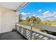 Balcony with distant views of trees and houses at 1100 Possum Trot Rd. # F-213, North Myrtle Beach, SC 29582