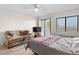 Bedroom with balcony access and partial ocean view at 1100 Possum Trot Rd. # F-213, North Myrtle Beach, SC 29582