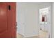 Condo entry with red door and bathroom at 1100 Possum Trot Rd. # F-213, North Myrtle Beach, SC 29582