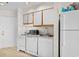 Clean kitchen featuring white cabinetry and appliances at 1100 Possum Trot Rd. # F-213, North Myrtle Beach, SC 29582