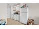 Efficient kitchen with appliances, ample cabinetry, and light flooring at 1100 Possum Trot Rd. # F-213, North Myrtle Beach, SC 29582