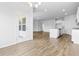 Bright dining room with hardwood floors, chandelier and backyard access at 1127 Nw Rosefield Way, Calabash, NC 28467